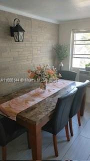 unfurnished dining area with light tile patterned floors