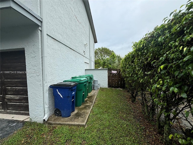 view of side of property with a lawn