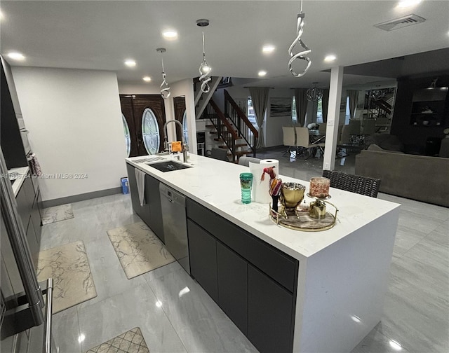 kitchen with pendant lighting, sink, stainless steel dishwasher, and a large island