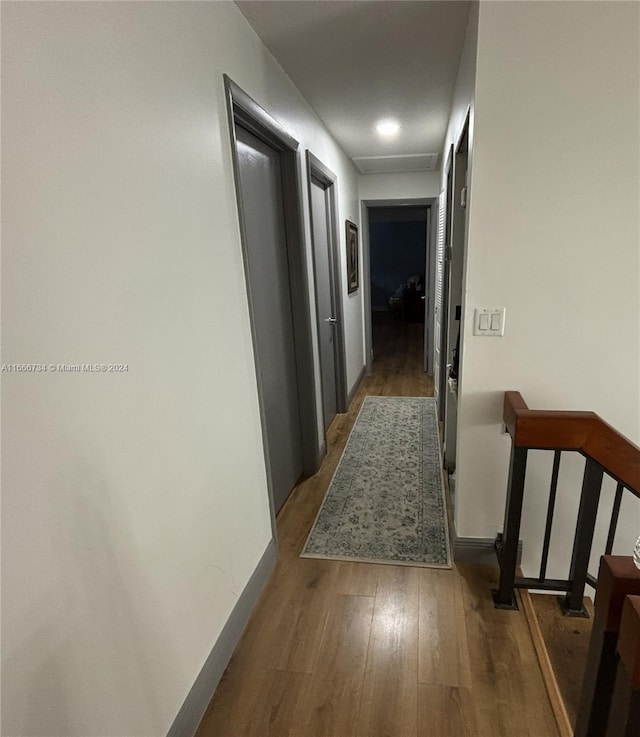 hallway featuring hardwood / wood-style flooring