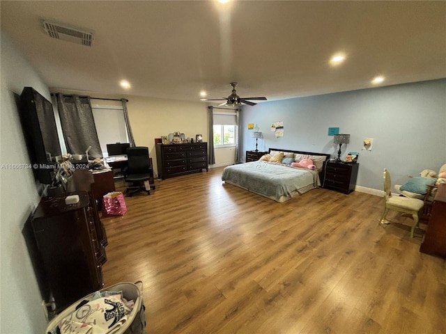 bedroom with hardwood / wood-style flooring and ceiling fan