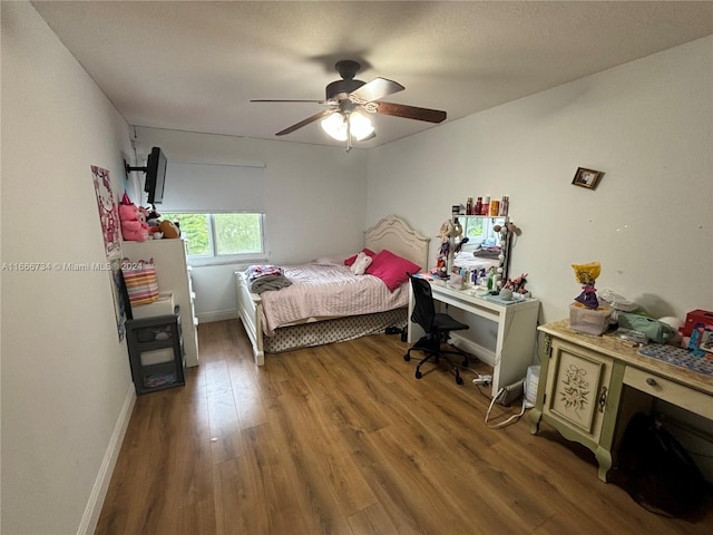 bedroom featuring hardwood / wood-style floors and ceiling fan