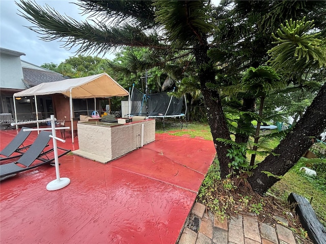 view of patio / terrace with a trampoline