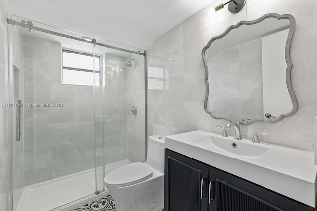 bathroom with walk in shower, vanity, toilet, and tile walls