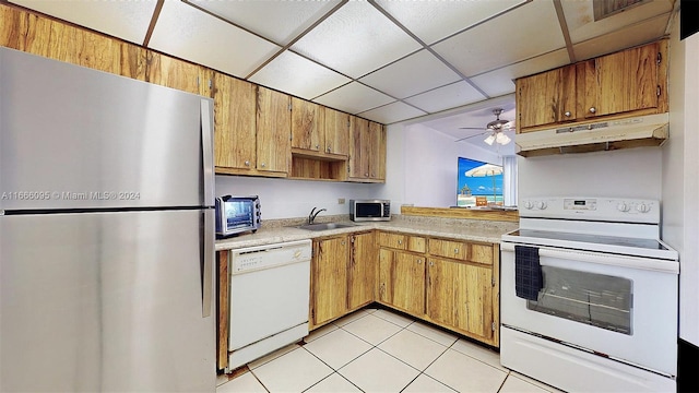 kitchen featuring ceiling fan, sink, light tile patterned floors, a paneled ceiling, and appliances with stainless steel finishes