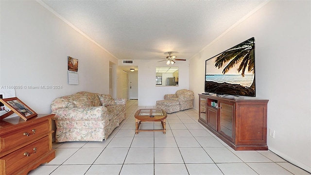 living room with a textured ceiling, light tile patterned floors, and ceiling fan