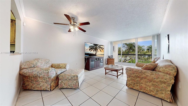 living room featuring ceiling fan, a textured ceiling, and light tile patterned floors