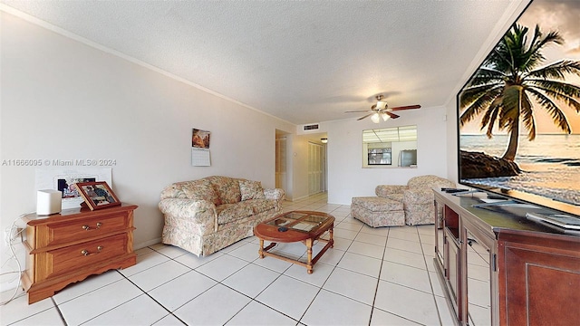 tiled living room with ornamental molding, ceiling fan, and a textured ceiling