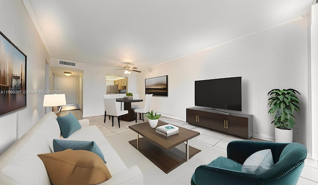 tiled living room featuring ornamental molding and ceiling fan