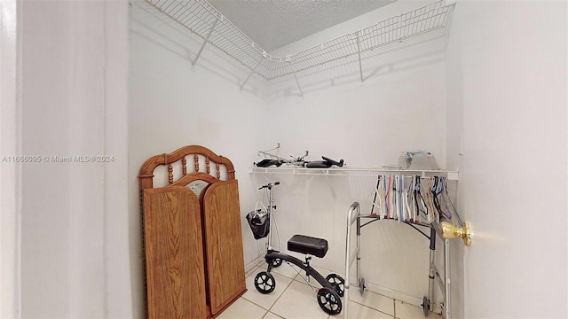 spacious closet featuring light tile patterned flooring