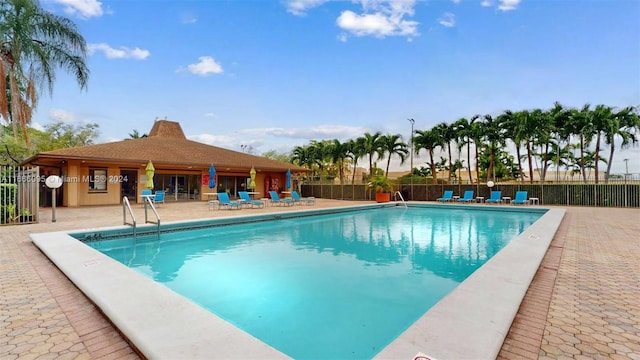 view of swimming pool featuring a patio area