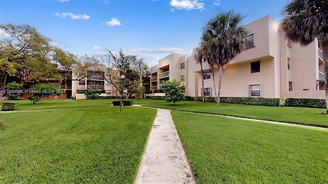 view of property's community with a yard