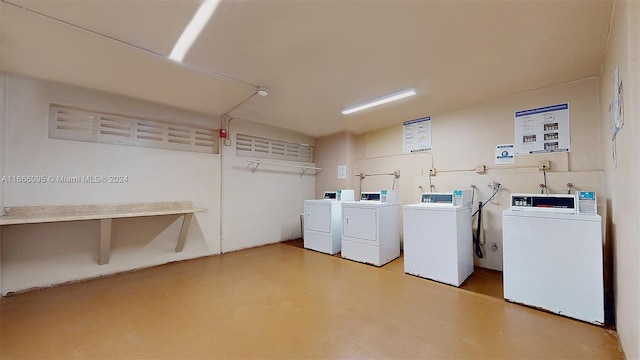 washroom with washing machine and clothes dryer