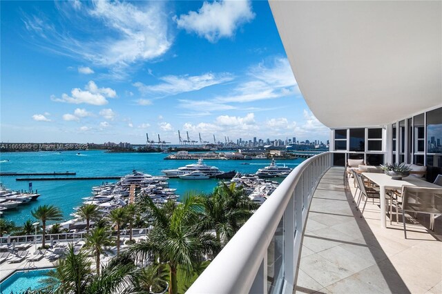 balcony featuring a water view