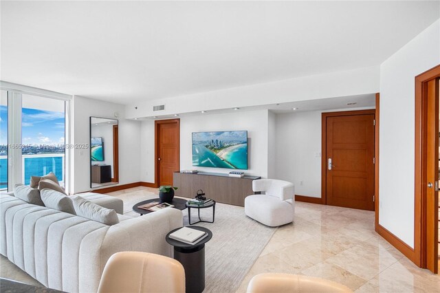 living room with floor to ceiling windows