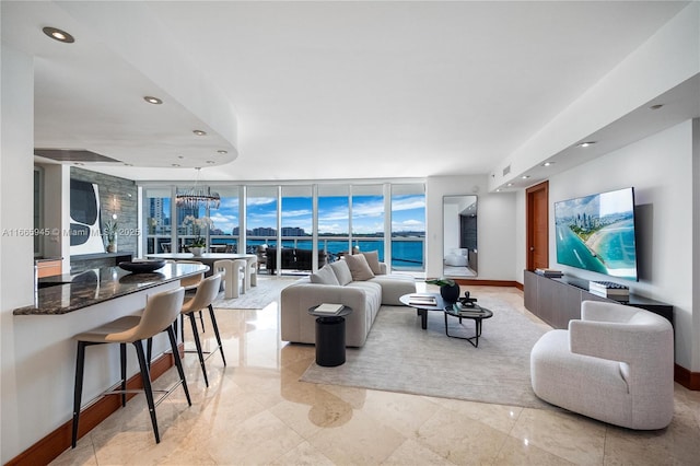 living room with floor to ceiling windows