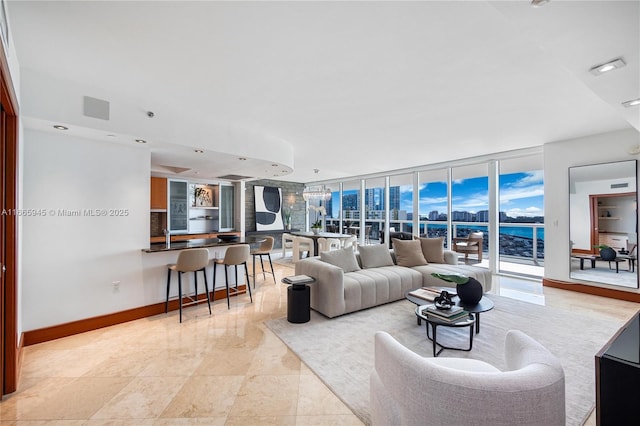 living room featuring floor to ceiling windows