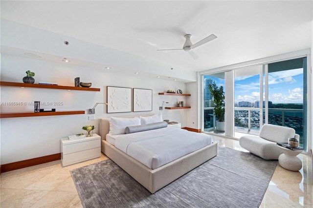 bedroom with access to exterior and floor to ceiling windows