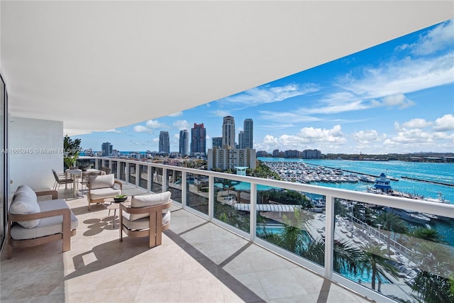 balcony featuring a water view