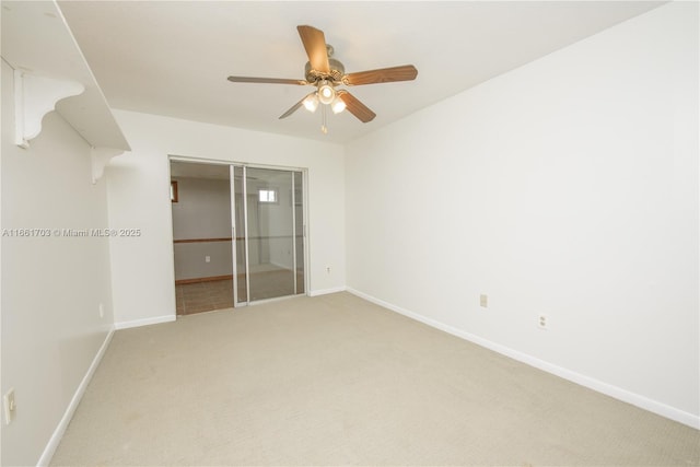 unfurnished bedroom with a ceiling fan, a closet, light carpet, and baseboards