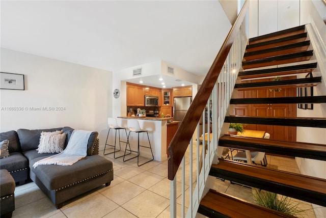 stairs with tile patterned flooring