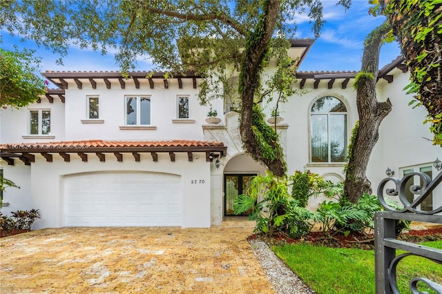 mediterranean / spanish-style house featuring a garage