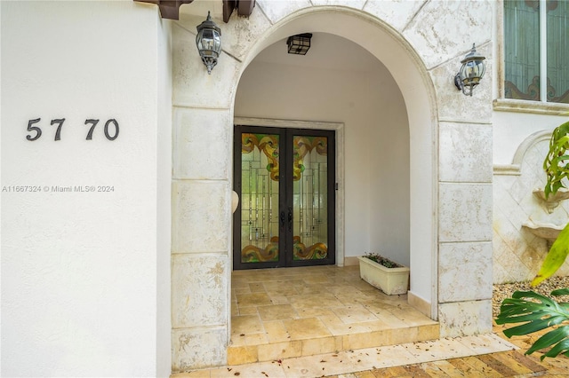 entrance to property featuring french doors