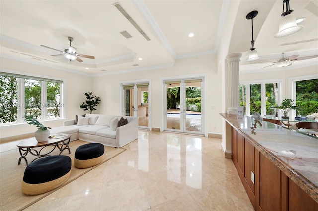 living room featuring ceiling fan and crown molding