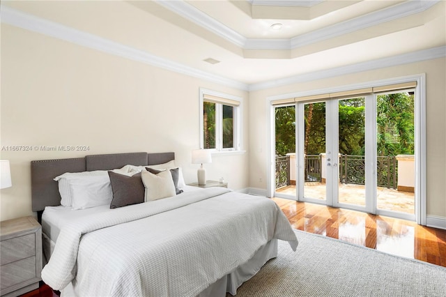 bedroom with crown molding, access to outside, and hardwood / wood-style flooring