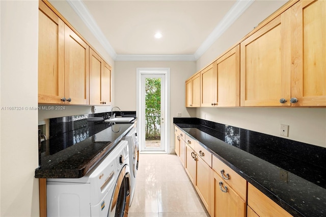 kitchen featuring dark stone countertops, light brown cabinets, and ornamental molding