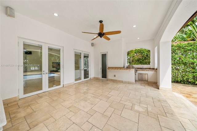 view of patio / terrace featuring french doors, area for grilling, and ceiling fan