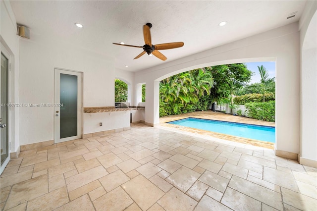 view of swimming pool with ceiling fan