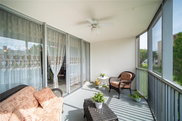 sunroom featuring ceiling fan