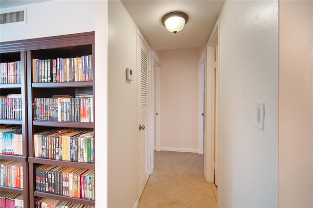 hallway with light tile patterned flooring