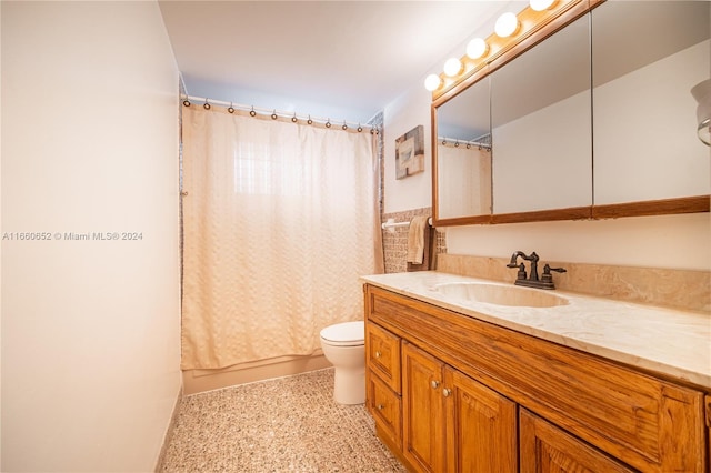 full bathroom featuring vanity, toilet, and shower / bath combo with shower curtain