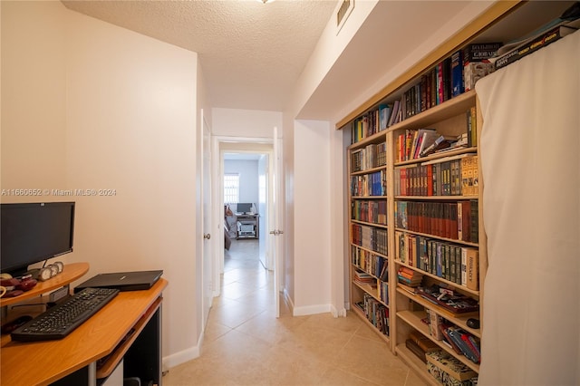 interior space with a textured ceiling