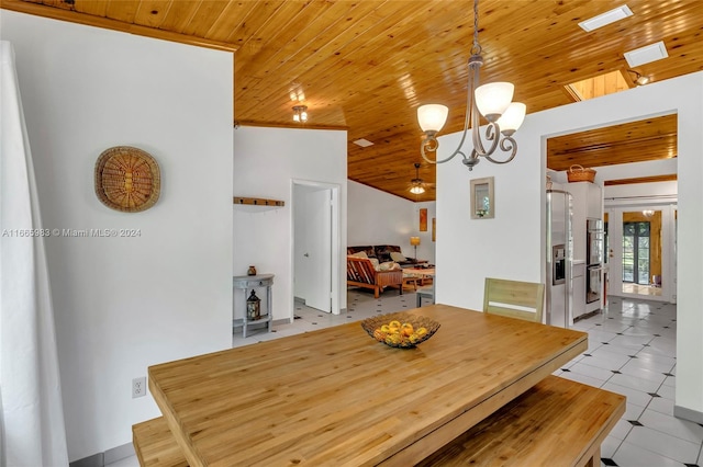 tiled dining area featuring an inviting chandelier, vaulted ceiling with skylight, and wood ceiling