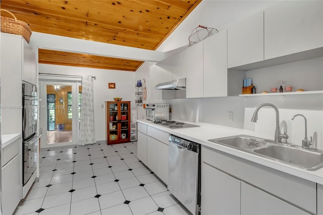 kitchen featuring vaulted ceiling, dishwasher, and white cabinets