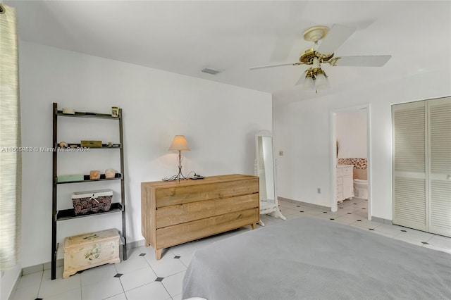 bedroom featuring ceiling fan, a closet, and ensuite bathroom