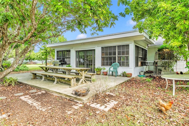 back of house featuring a patio