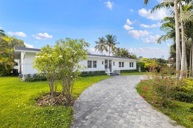 ranch-style house with a front yard