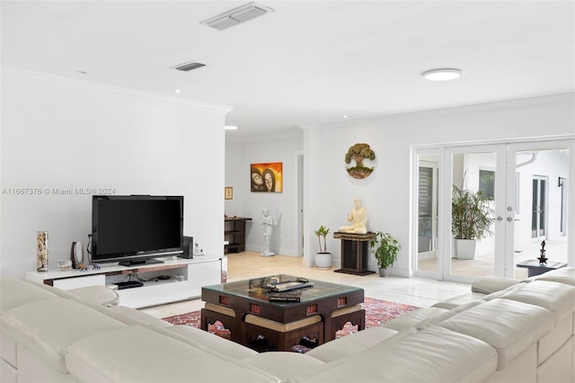 living room featuring french doors and crown molding