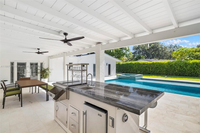 view of patio / terrace featuring a wet bar, a pool with hot tub, and ceiling fan