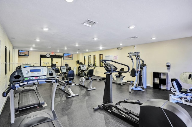 workout area with a textured ceiling