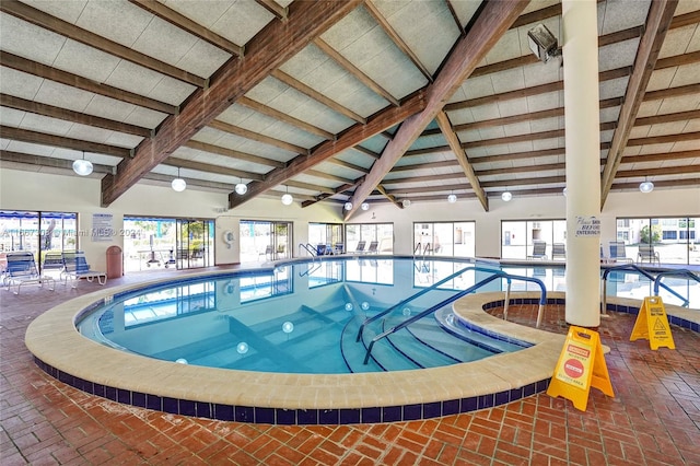 view of pool with a hot tub