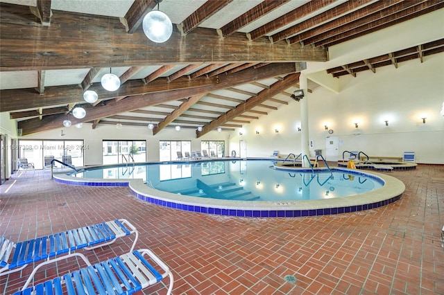 view of swimming pool with a jacuzzi