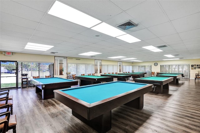 game room with a drop ceiling, pool table, and hardwood / wood-style flooring