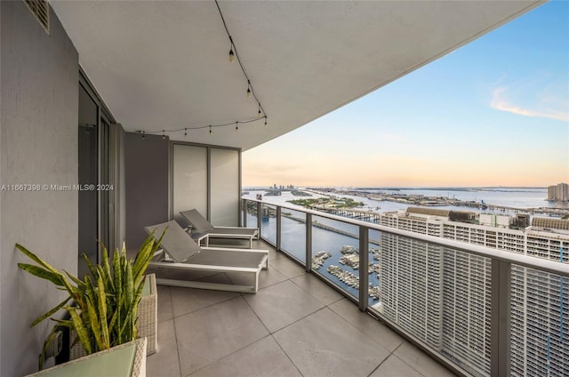 balcony at dusk with a water view