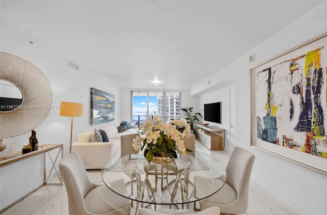 dining area featuring expansive windows