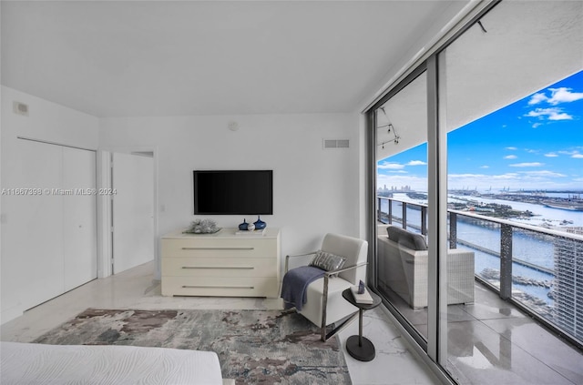 living room with floor to ceiling windows